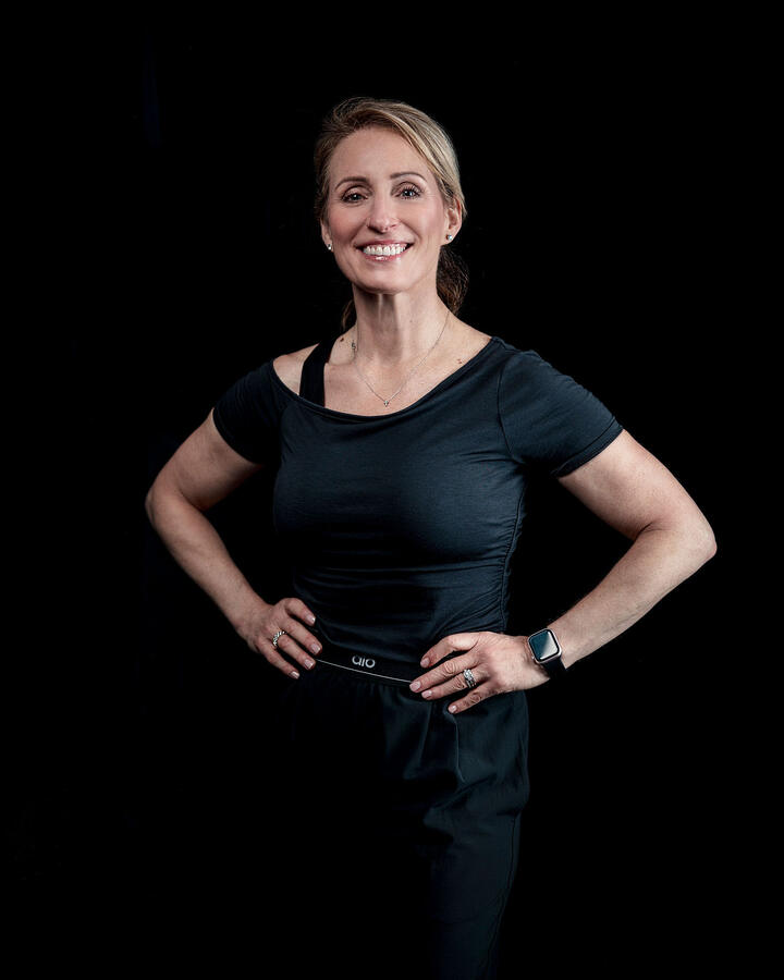 Lena Peron, owner of LP Pilates, in black and smiling